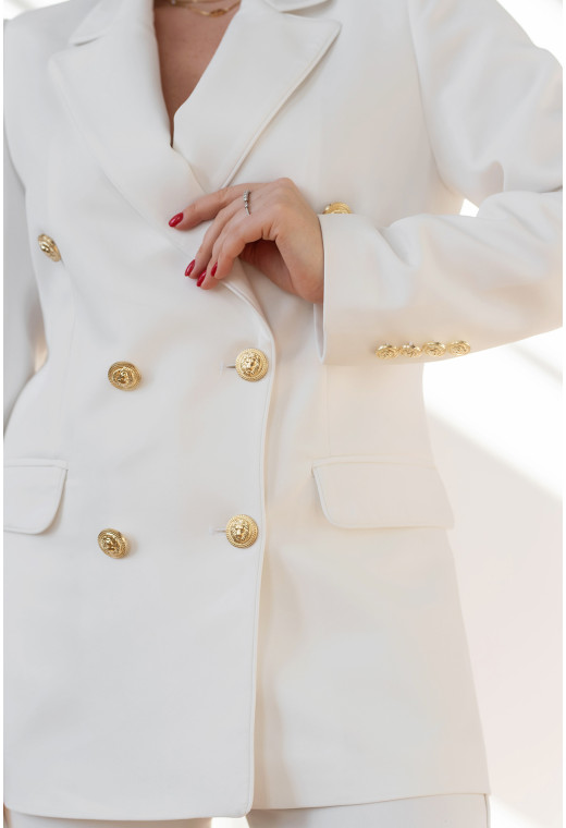 Білий брючний костюм з золотими гудзиками — 611670. Maritel. Зображення 1 Білий брючний костюм з золотими гудзиками — 611670. Maritel. Зображення 1